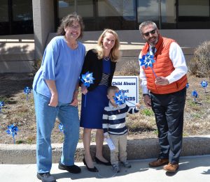 From left, Commissioner Holly Williams, Commissioner Came Bremer, and Commissioner Mark Waller planted pinwheels April 18, 2019, for Child Abuse Prevention Month. The pinwheels serve as symbols of the happy, playful childhoods desired for all children.