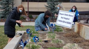 El Paso County Department of Human Services staff plant pinwheels in front of Centennial Hall in downtown Colorado Springs on Tuesday, April 13, 2021, to mark national Child Abuse Prevention Month. Blue pinwheels symbolize the happy childhood desired for all children.