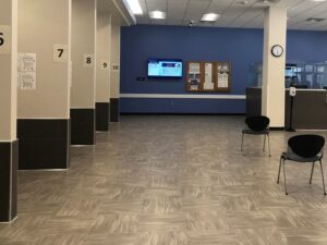 A photo showing chairs and dividers for numbered counters in the new Department of Human Services lobby. The El Paso County Department of Human Services main lobby is on the first floor of the Citizens Service Center building. The new lobby opened at the very end of February 2021.